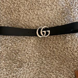 Gucci leather belt with double G buckle.